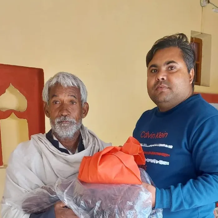 Pankaj supporting an elderly community member