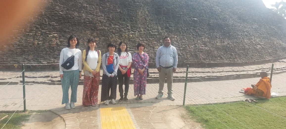 A small private tour group at a Kushinagar heritage site