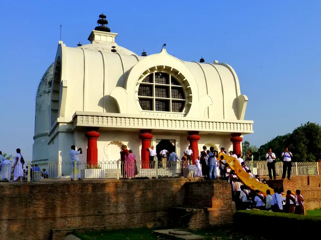 Front view of Mahaparinirvana Temple in Kushinagar with pilgrims outside